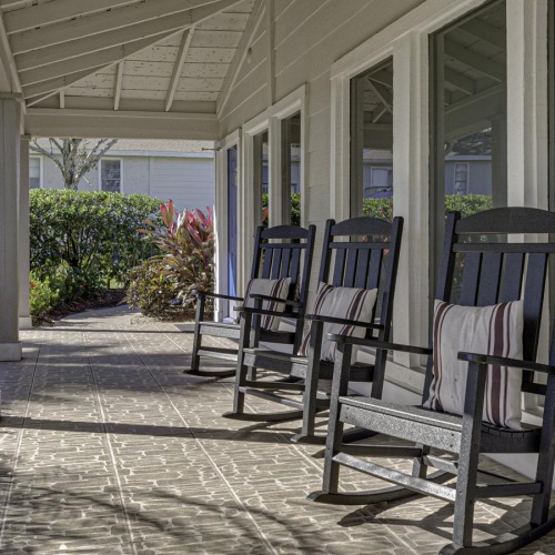 a patio with chairs and a table