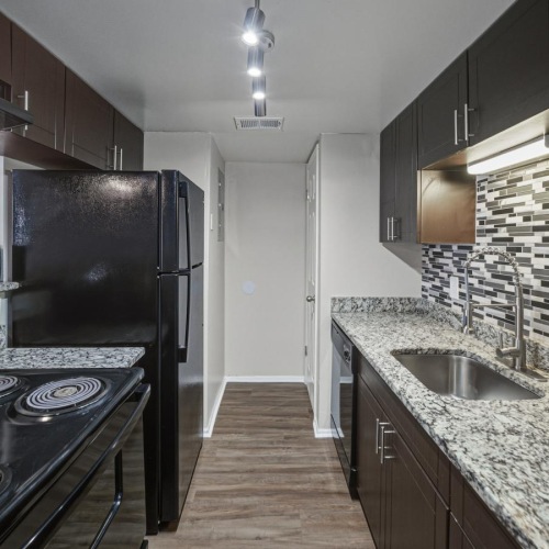 a kitchen with a marble countertop