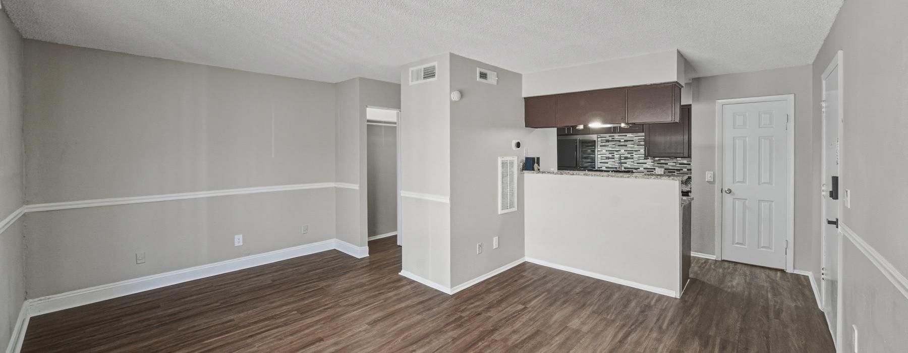 a large empty room with wood floors