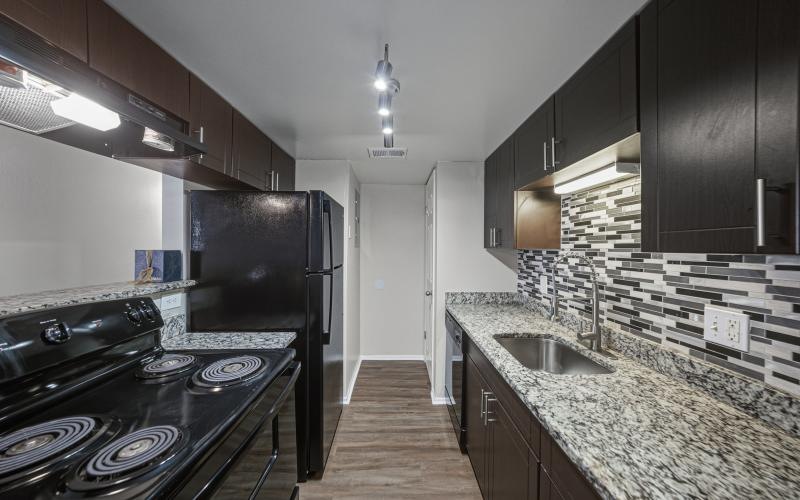 a kitchen with a marble countertop